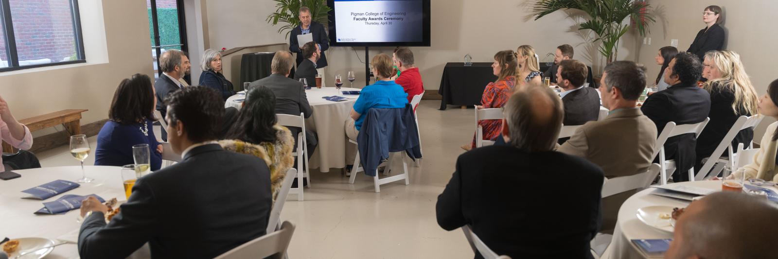 Shot of room with Dean Buchheit at podium at 2026 Faculty Awards Ceremony 
