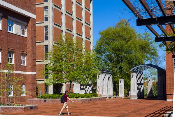 Student walking across engineering quad near Anderson Tower