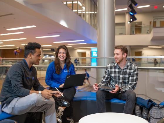Group of three engineering students socializing 